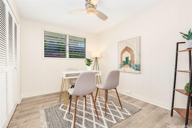 home office featuring ceiling fan and light hardwood / wood-style floors