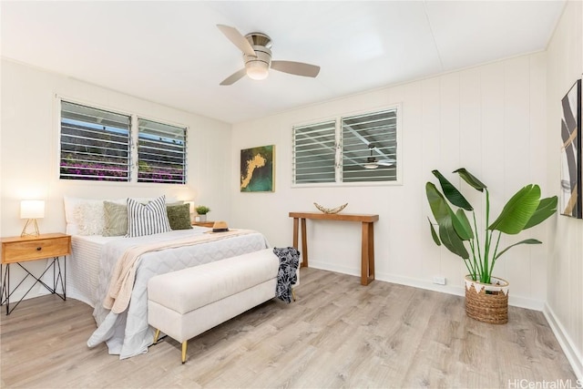 bedroom with ceiling fan and light wood-type flooring