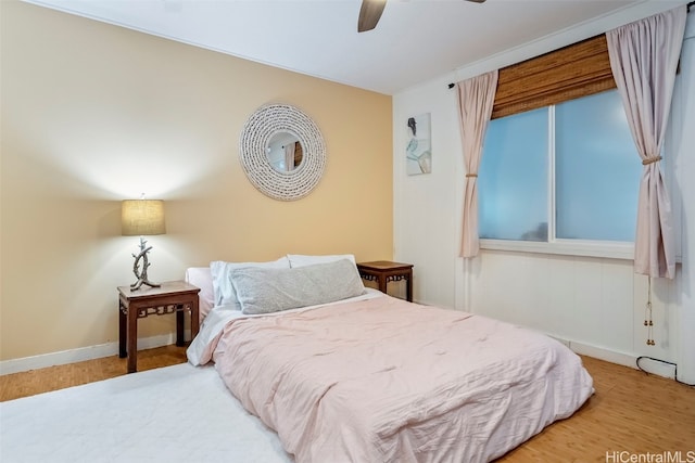 bedroom featuring hardwood / wood-style flooring and ceiling fan