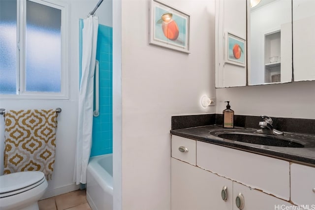 full bathroom featuring vanity, shower / bathtub combination with curtain, tile patterned floors, and toilet