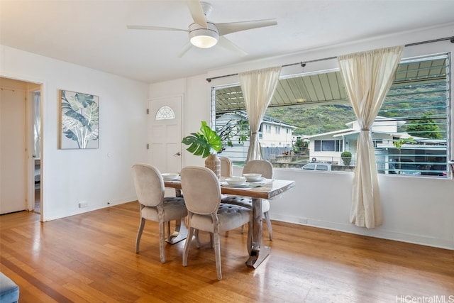 dining room featuring ceiling fan and light hardwood / wood-style flooring