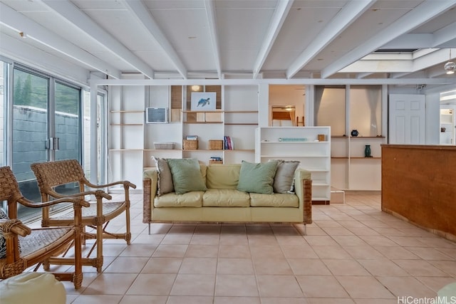 interior space featuring light tile patterned floors and beamed ceiling