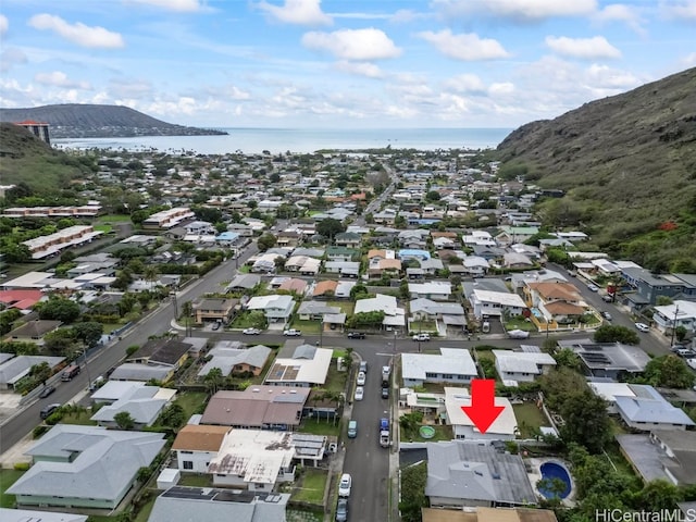 aerial view featuring a water and mountain view