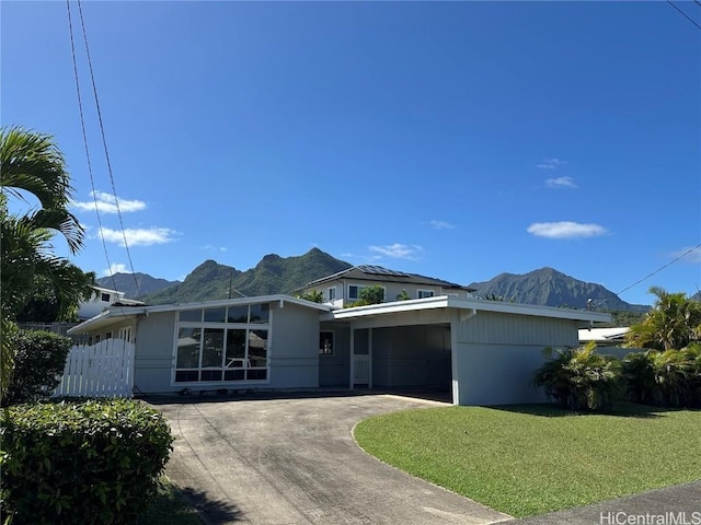 view of front facade with a mountain view and a front yard