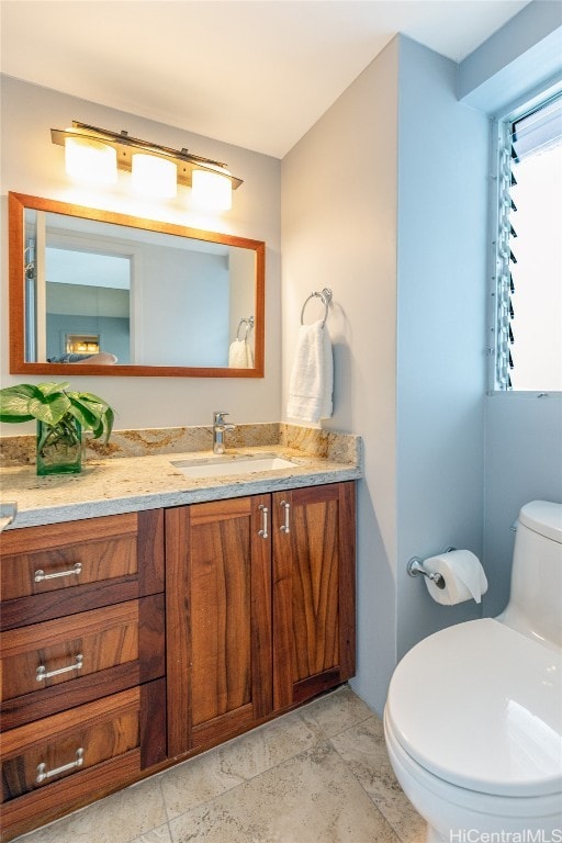 bathroom with vanity and toilet