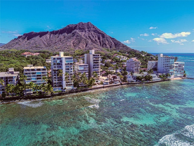 exterior space with a water and mountain view