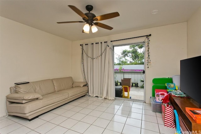 tiled living room featuring ceiling fan