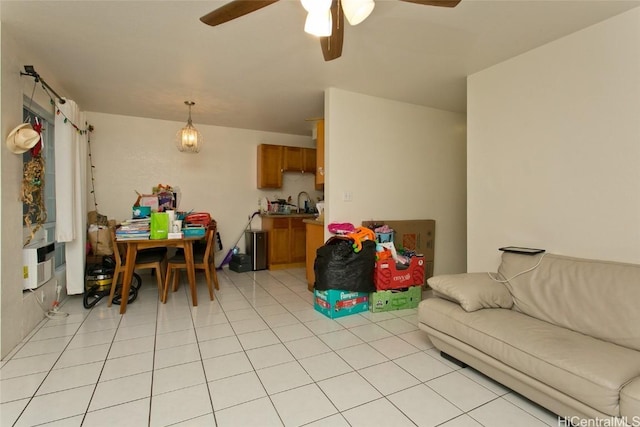 living room featuring light tile patterned flooring and ceiling fan