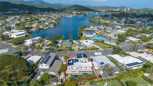 drone / aerial view with a residential view and a water and mountain view