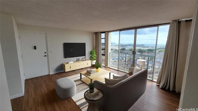 living room with floor to ceiling windows, wood-type flooring, and a textured ceiling