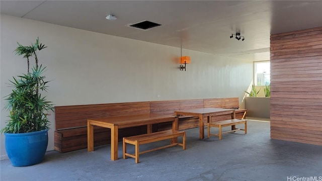 dining space with concrete flooring