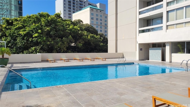 view of pool featuring a patio area