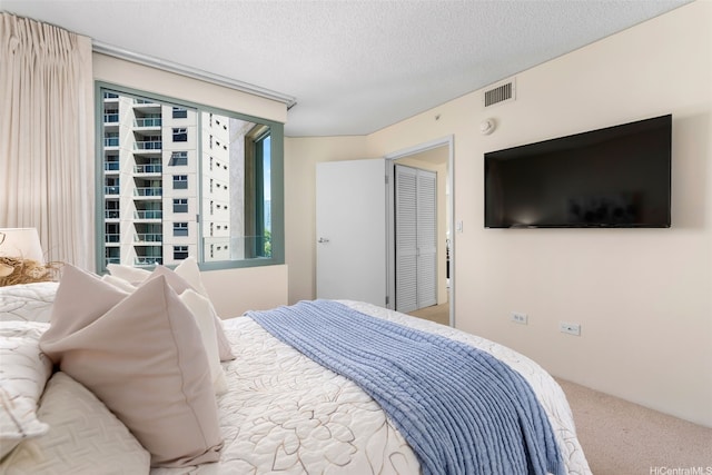 1314 Kalakaua Ave Unit 406, Honolulu, HI 96826 - bedroom with carpet floors and a textured ceiling
