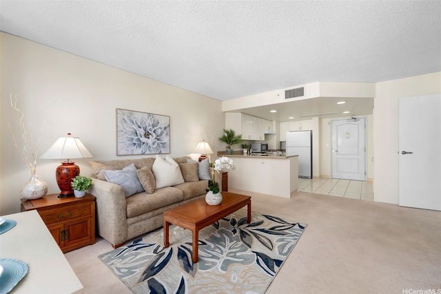 1314 Kalakaua Ave Unit 406, Honolulu, HI 96826 - living room featuring light colored carpet and a textured ceiling