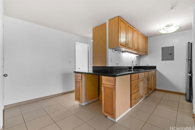 kitchen with stainless steel fridge, sink, and electric panel