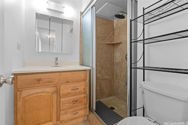 bathroom with walk in shower, vanity, and toilet