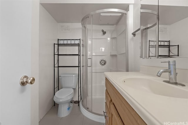 bathroom with a shower with door, vanity, tile patterned flooring, and toilet