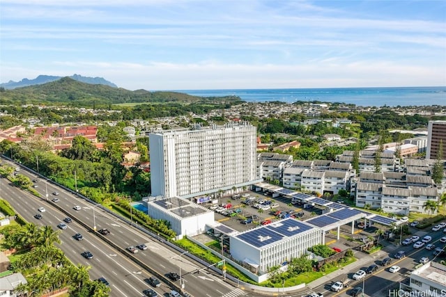 drone / aerial view featuring a water and mountain view