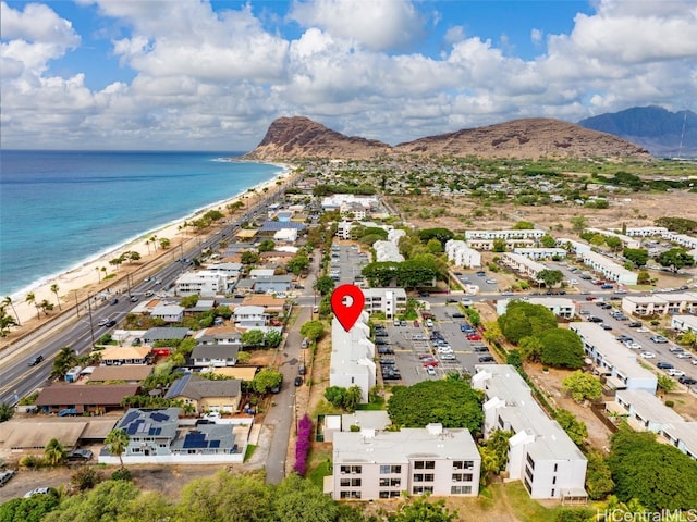 aerial view featuring a beach view and a water and mountain view