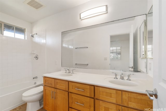 full bathroom featuring shower / tub combination, vanity, toilet, and tile patterned flooring