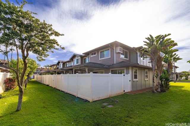 back of house featuring a yard