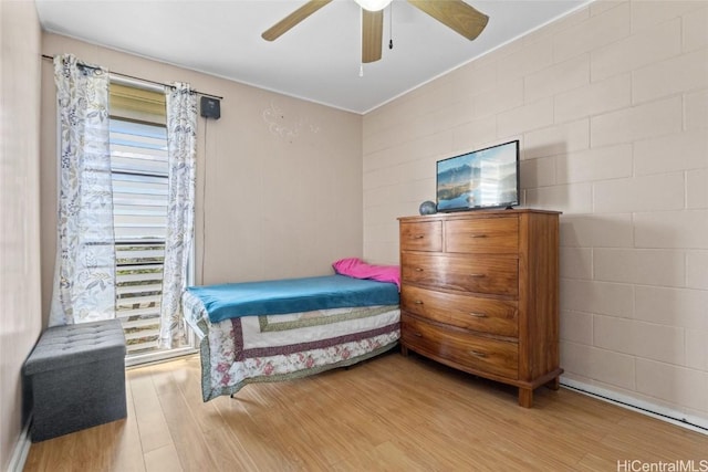 bedroom with hardwood / wood-style flooring and ceiling fan