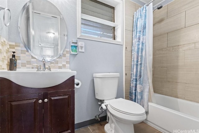 full bathroom featuring tasteful backsplash, tile patterned flooring, vanity, toilet, and shower / bath combo with shower curtain