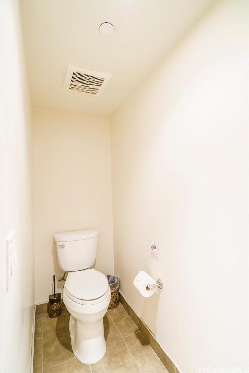 bathroom featuring tile patterned flooring and toilet