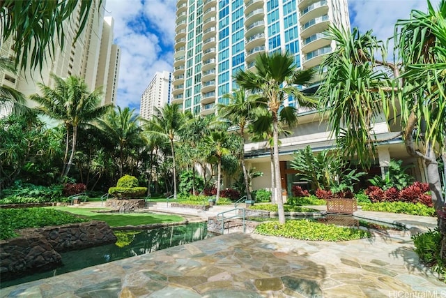 surrounding community featuring a patio