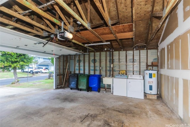 garage with a garage door opener, sink, separate washer and dryer, electric panel, and water heater