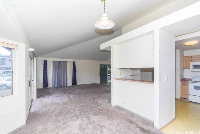 unfurnished living room featuring light colored carpet and lofted ceiling