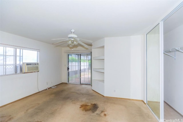 carpeted empty room with cooling unit and ceiling fan