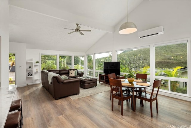 sunroom / solarium featuring vaulted ceiling, a wall mounted air conditioner, and ceiling fan