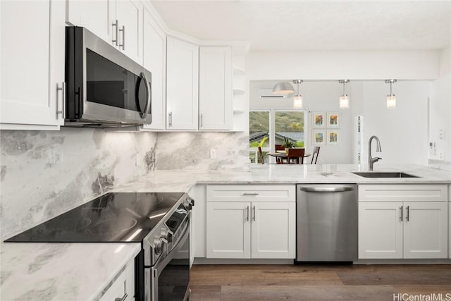 kitchen with sink, stainless steel appliances, and white cabinets