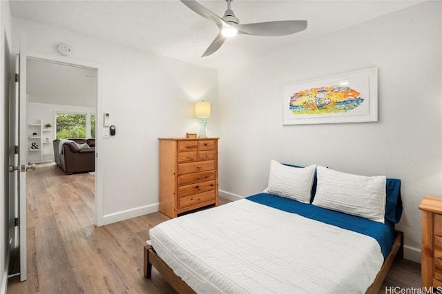 bedroom with ceiling fan and light hardwood / wood-style floors