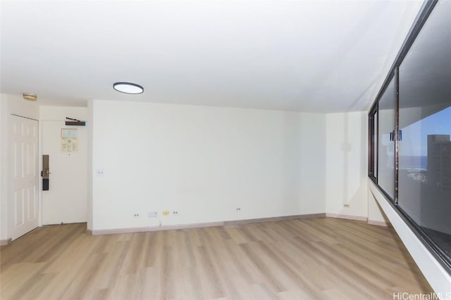 unfurnished living room with light wood-type flooring