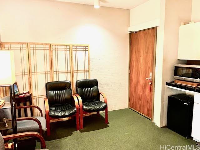 sitting room with carpet flooring