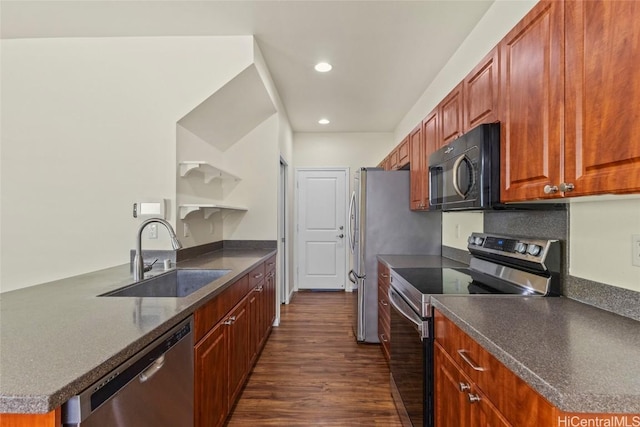 kitchen featuring dark hardwood / wood-style flooring, sink, stainless steel appliances, and kitchen peninsula