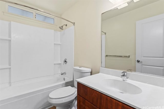 full bathroom featuring vanity, bathtub / shower combination, and toilet