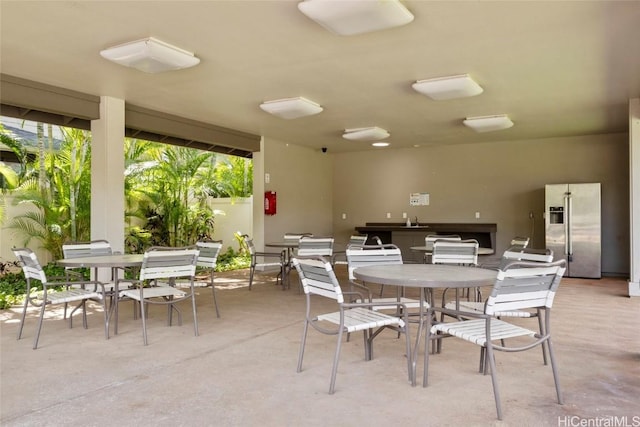 view of patio with area for grilling and sink