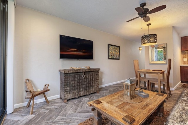 living room featuring parquet flooring and ceiling fan