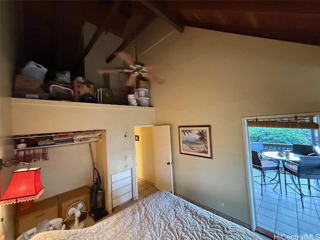 tiled bedroom with beamed ceiling, high vaulted ceiling, and access to outside