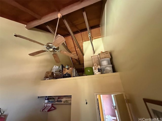 details featuring ceiling fan and beam ceiling