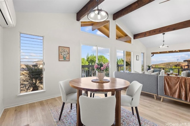 dining area with a wall mounted air conditioner, lofted ceiling with beams, and light wood-type flooring