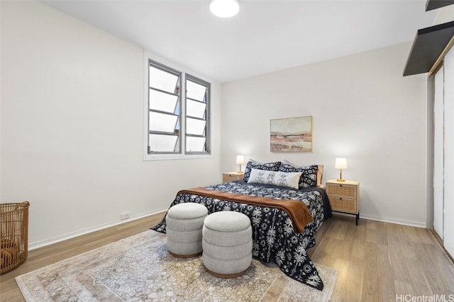 bedroom with hardwood / wood-style floors