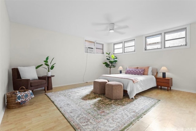 bedroom featuring hardwood / wood-style floors and ceiling fan