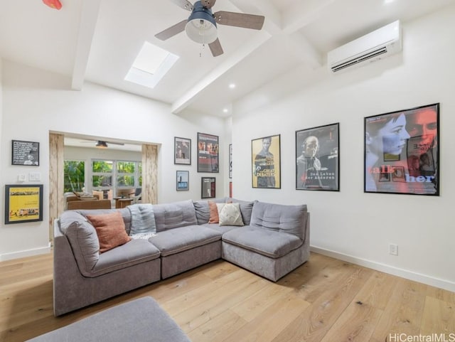 living room with ceiling fan, light hardwood / wood-style floors, and a wall unit AC