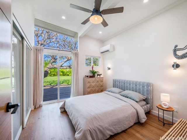 bedroom featuring beam ceiling, hardwood / wood-style floors, a wall unit AC, and access to outside