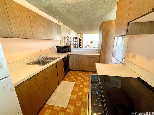 kitchen with sink, a textured ceiling, and black appliances