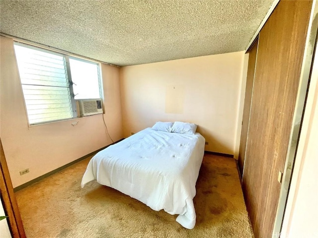 bedroom with cooling unit, a closet, light carpet, and a textured ceiling